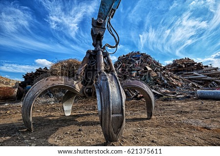 Gripper excavator on a scrap yard. HDR - high dynamic range