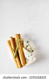 Grissini With Blue Cheese, Bread Stick, Italian Traditional Cuisine Close Up On White Background, Top View, Vertical