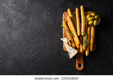 Grissini With Blue Cheese, Bread Stick, Italian Traditional Cuisine Close Up On Black Background, Top View, Copy Space