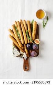 Grissini With Blue Cheese, Bread Stick, Italian Traditional Cuisine Close Up On White Background, Top View, Vertical