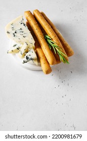 Grissini With Blue Cheese, Bread Stick, Italian Traditional Cuisine Close Up On White Background, Top View, Vertical