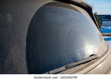 Grit And Dust Covered Rear Window Of A Van With Wiper Track