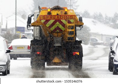 A Gritter Spreading Salt On A Road In The Winter Snow, South East London, UK .