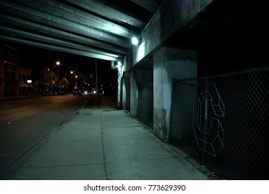 Gritty Dark Chicago Highway Bridge Underpass With Traffic At Night.