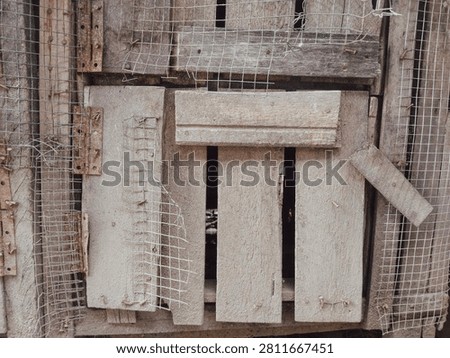 Gritty distressed texture combination of raw weathered concrete surface and old rustic wooden planks, creating an industrial vintage backdrop