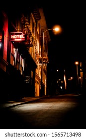Gritty Urban Alley Way With Hotel Sign Lit In Neon - Noir Look,,