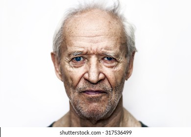 Grizzled And Unshaven The Serious Old Man With Blue Eyes