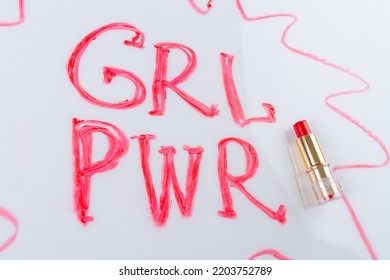 Grl pwr incription and red lipstick isolated on white background. Girl power concept. - Powered by Shutterstock