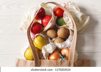 groceries in eco bags. eco natural bags with fruits and vegetables, eco friendly, flat lay. sustainable lifestyle concept. zero waste food shopping. plastic free items. reuse, reduce, recycle, refuse