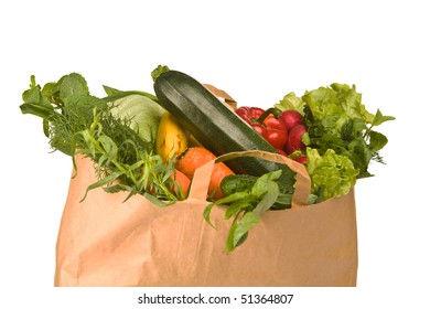 A grocery bag full of healthy vegetables