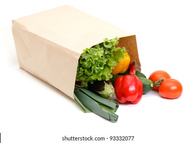 Grocery Bag Full Of Vegetables Isolated On White Background