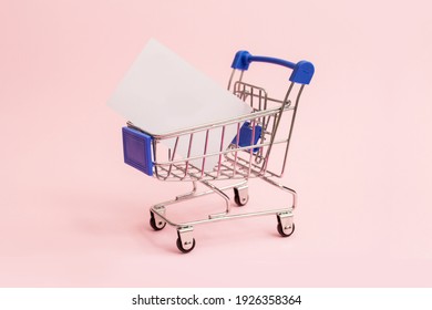 Grocery Cart With Blank Business Card For Inscription. Shopping Concept. Copy Ad Space.