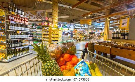 Grocery Cart At A Supermarket Filled Up With Food Products As Seen From The Customers Point Of View