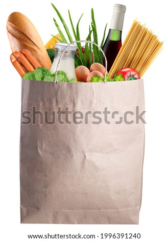 Grocery paper bag with fresh vegetables, bottle of wine and other foodstuffs on white background. File contains clipping path.
