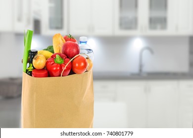 Grocery Shopping Concept Image - Eco Friendly Paper Shopping Bag Filled With Various Food Products In The Kitchen.