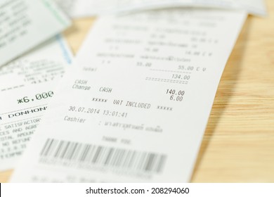 Grocery Shopping List On A Till Roll Printout On Wood Board Background