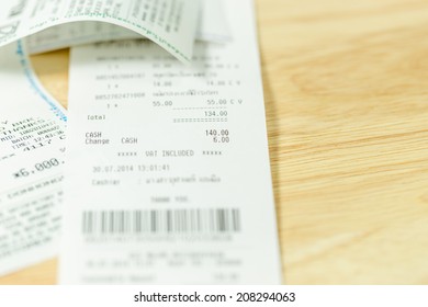 Grocery Shopping List On A Till Roll Printout On Wood Board Background