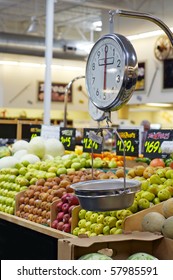 Grocery Store Scale With Fruit And Veg In Background