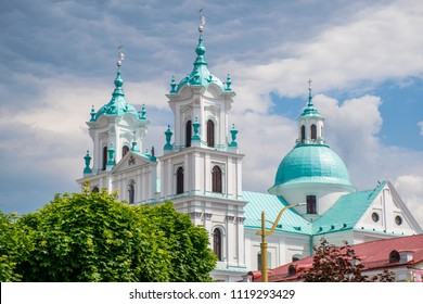 Grodno, Belarus. Famous Landmark Is St. Francis Xavier Cathedral At Sunny Summer Day In Hrodna. Best destination for summer vacation. Interesting journey for all family in East Europe.