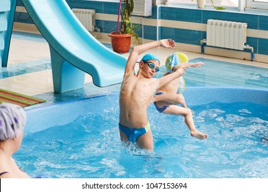 GRODNO, Belarus - Health Resort Porechye. Children Skiing With A Water Slide Swimming In The Pool