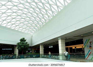 Grodno, Belarus May 20, 2021: Wide And Spacious Lobby On The Top Floor Of The Shopping Center. Beautiful Designer Ceiling Of Geometric Shape And Unusual Perspective In The Mall Center.