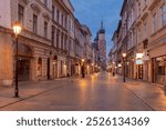 Grodzka Street in Krakow, Poland, at dawn, with a view toward St. Mary