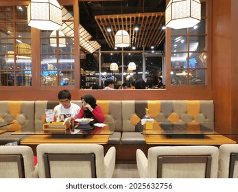 Grogol, West Jakarta - Indonesia : November 19th 2020: A Couple Enjoy Dinner Together At Quite Restaurant