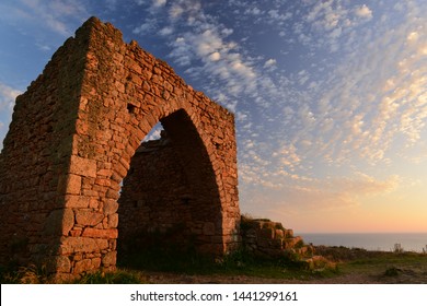 Gronez Castle, Jersey, U.K. 14th century coastal ruin in the Summer near sunset.