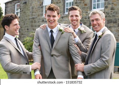 Groom With Best Man And Groomsmen At Wedding