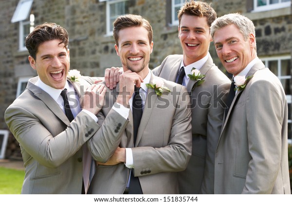 Groom With Best\
Man And Groomsmen At\
Wedding