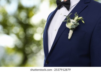 Groom with boutonniere outdoors, closeup. Wedding accessory - Powered by Shutterstock