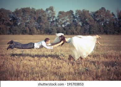 Groom And Bride Flies On Wedding Photo