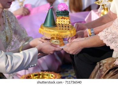 Groom And Bride Offering Tray Of Gift To Older  In Traditional Thai Wedding Ceremony. Concept Of Marriage.