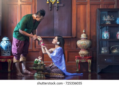 Groom And Bride Offering Tray Of Gift To Older In Traditional Thai Wedding Ceremony. Concept Of Marriage.