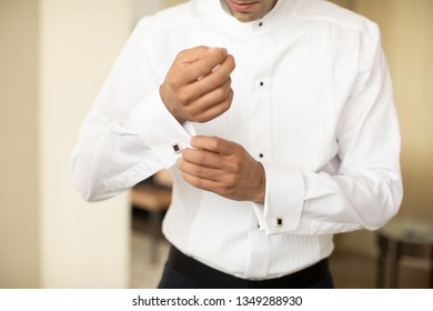 Groom Getting Ready For Wedding, Putting On Cuff Links