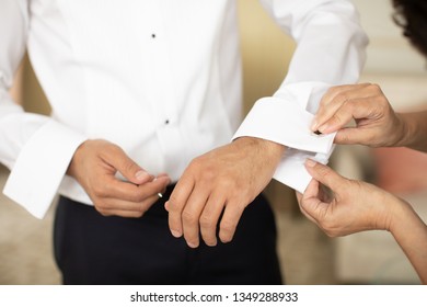 Groom Getting Ready For Wedding, Putting On Cuff Links