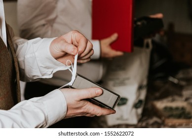 Groom Giving Groomsmen Gifts Before Wedding