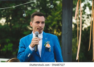 Groom Holding Microphone And Talking Speech