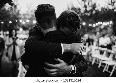 A Groom Is Hugging With A Best Man. Farewell Hug Concept.