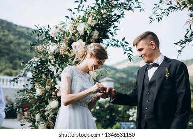 Groom kissing bride on wedding ceremony