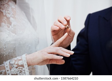 Groom put on ring to bride at jewish wedding