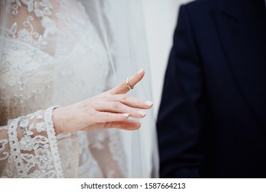 Groom put on ring to bride at jewish wedding