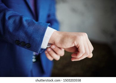 the groom straightens the wedding suit - Shutterstock ID 1503203558