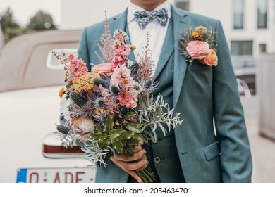 Groom Waiting With The Flowers