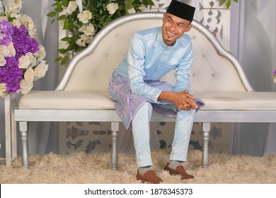 Groom Wearing Baby Blue Malay Traditional Cloth Pose During Wedding Celebration