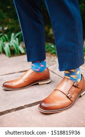 Groom Wearing Two Different Socks. Brown Shoes And Funny Socks. Formal Occasion And Silly Fashion. Taco And Flamingo Socks.