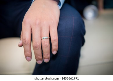Groom with a wedding ring on hand