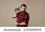 Grooming of real man. handsome hipster with axe. logger or axeman concept