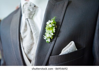 Groom's Buttonhole. A Closeup Of A Groom's Morning Suit, Tie, Handkerchief And Buttonhole.