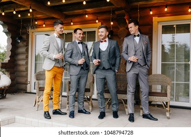 The Groom's Friends Laugh And Drink Whiskey